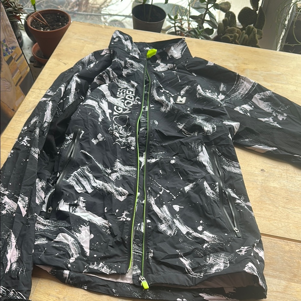 Woman’s black and pinky white athletic jacket for running